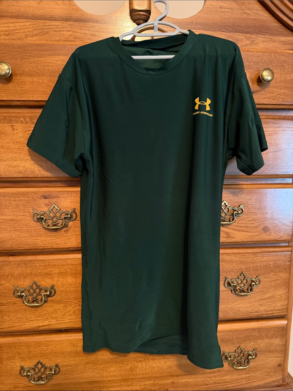 Under Armour boy’s  Forest Green Short Sleeve Performance Tee with Yellow Logo